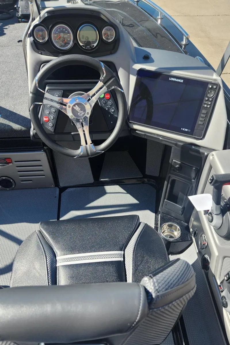 Slide: The Image of 2024 Ranger 621FS Ranger Cup Equipped boat cockpit with steering wheel and navigation system. - 7