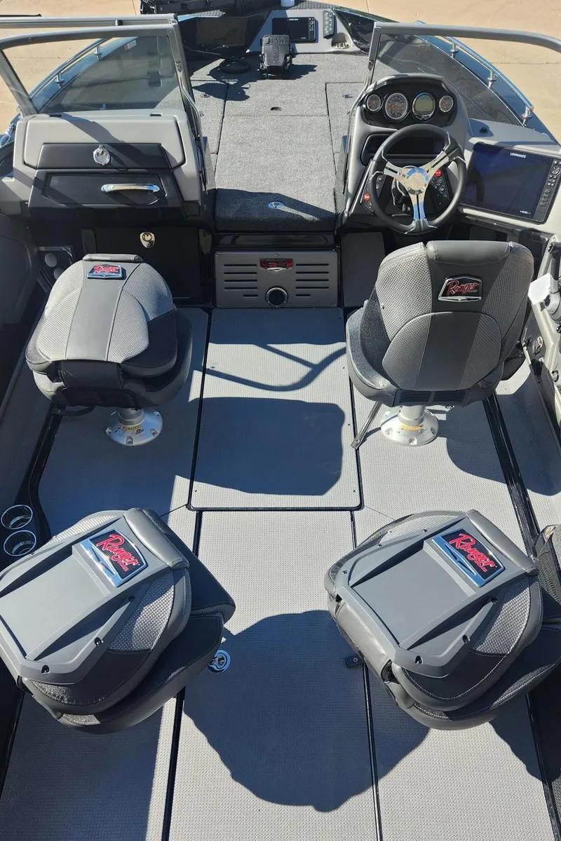 Slide: The Image of 2024 Ranger 621FS Ranger Cup Equipped boat interior with seating and dashboard. - 9