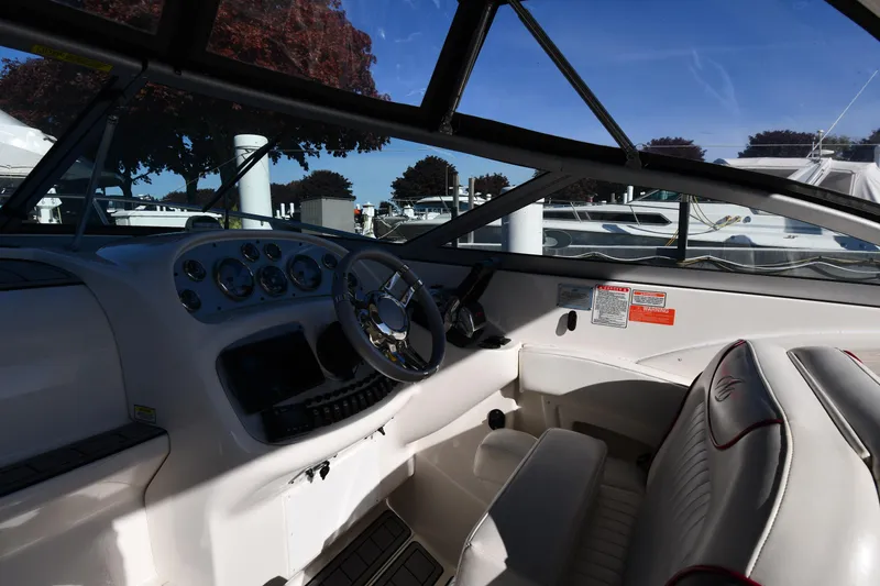 Slide: The Image of 2006 Monterey 298SC Super Sport boat docked at marina with waterfront view. - 11