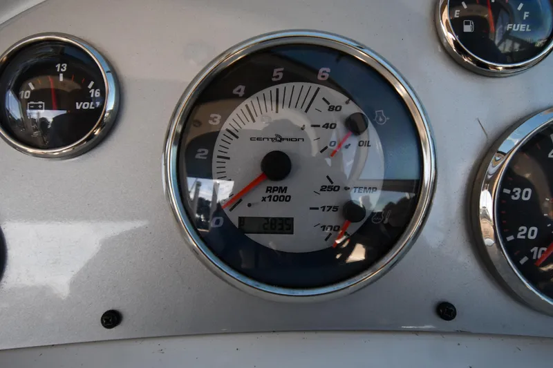 Slide: The Image of Interior of 2006 Monterey 298SC Super Sport boat with steering wheel and seating. - 14