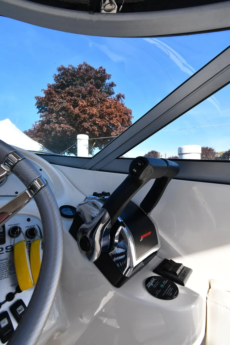 Slide: The Image of 2006 Monterey 298SC Super Sport boat interior with steering wheel and dashboard. - 16