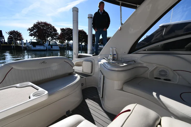 Slide: The Image of 2006 Monterey 298SC Super Sport boat interior with steering wheel and seating. - 21