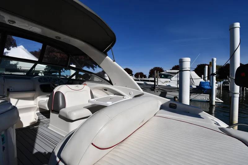 Slide: The Image of 2006 Monterey 298SC Super Sport boat interior with helm and seating. - 22