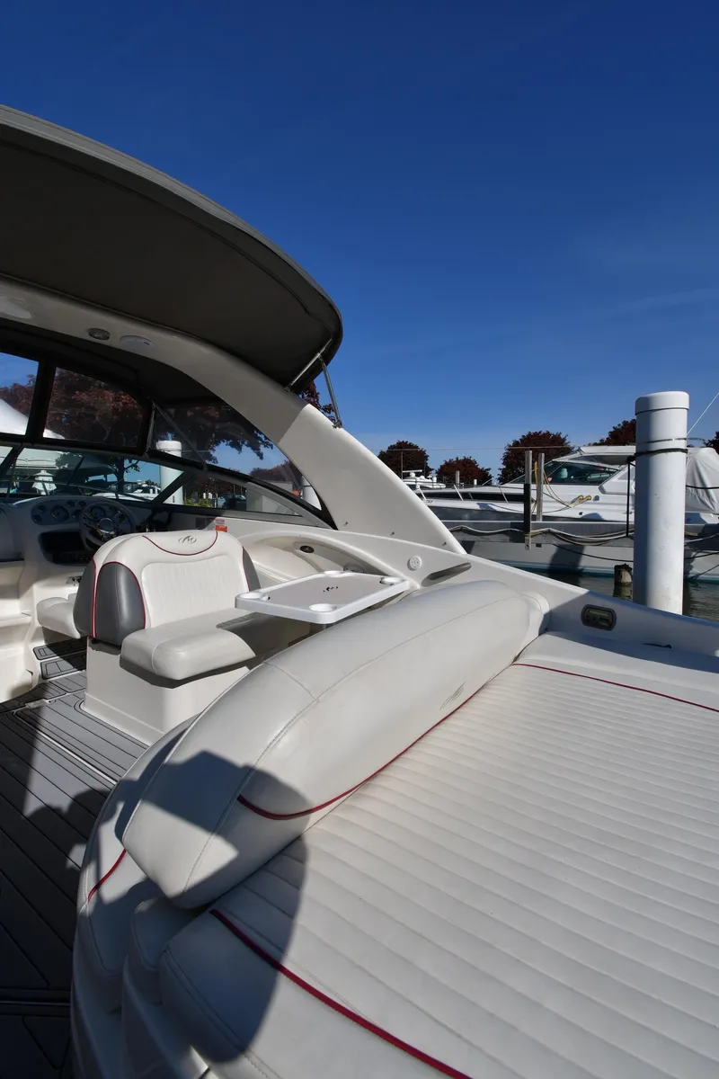 Slide: The Image of 2006 Monterey 298SC Super Sport boat interior with seating and sleek design. - 23