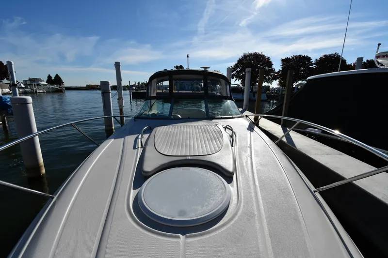 Slide: The Image of 2006 Monterey 298SC Super Sport boat with red and white exterior on display. - 4