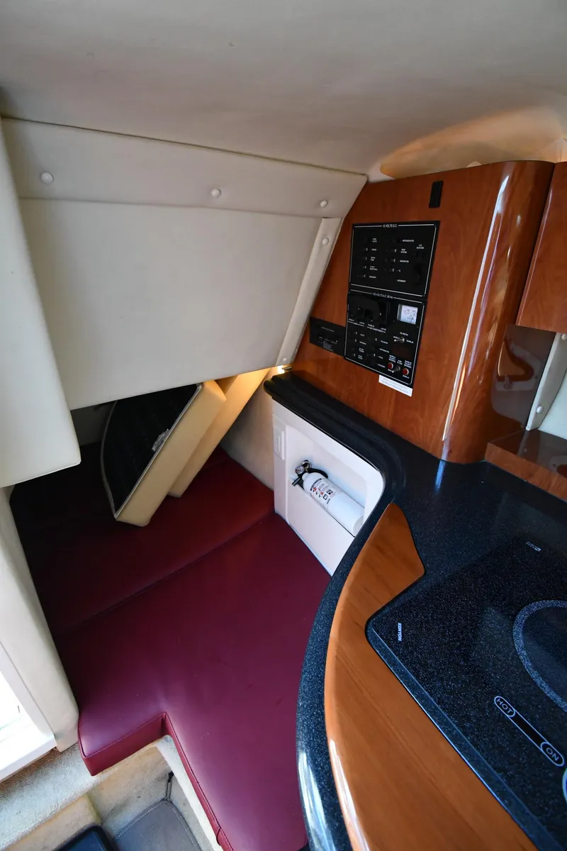 Slide: The Image of 2006 Monterey 298SC Super Sport boat kitchen with stove and sink. - 48