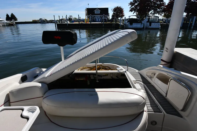 Slide: The Image of Microwave in 2006 Monterey 298SC Super Sport boat interior with wood paneling. - 50