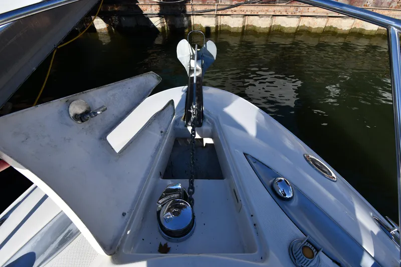 Slide: The Image of 2006 Monterey 298SC Super Sport boat docked under clear blue sky. - 6
