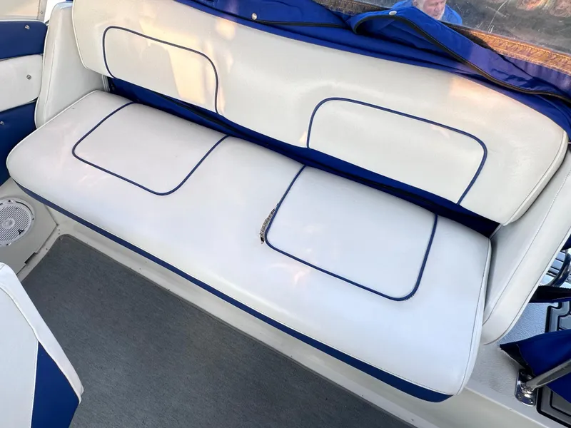 Slide: The Image of White and blue seating on a 1994 Carver 340 Santego boat. - 14