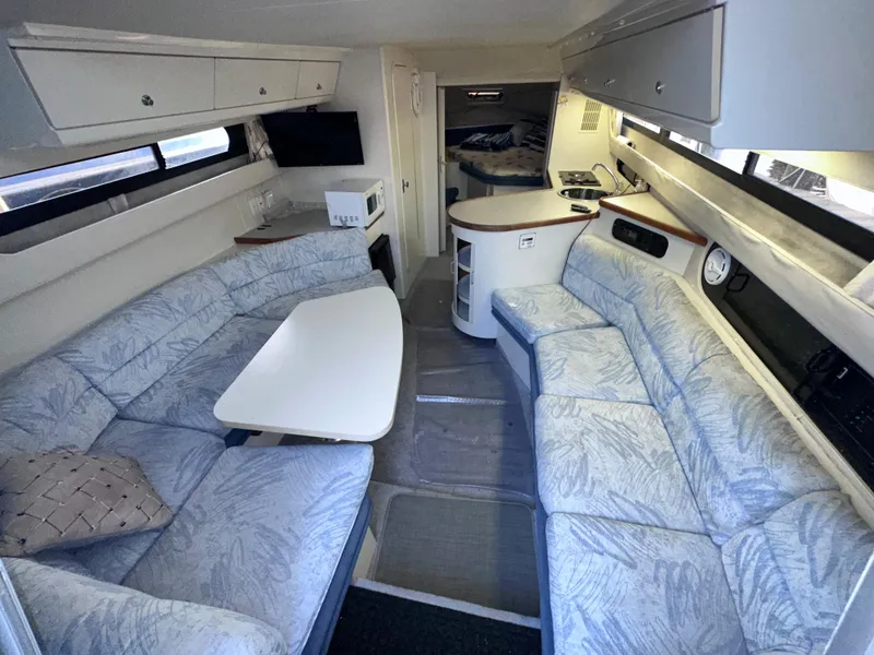 Slide: The Image of 1994 Carver 340 Santego yacht interior with spacious seating and modern amenities. - 31