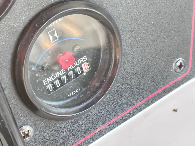 Slide: The Image of 1994 Carver 340 Santego engine hour meter showing 710 hours. - 8