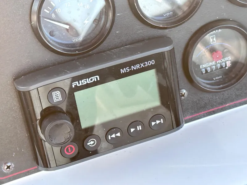 Slide: The Image of Fusion MS-NRX300 marine stereo on 1994 Carver 340 Santego dashboard. - 9