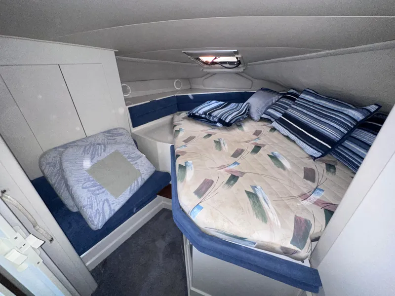 Slide: The Image of Interior cabin of 1994 Carver 340 Santego with bed and seating area. - 16