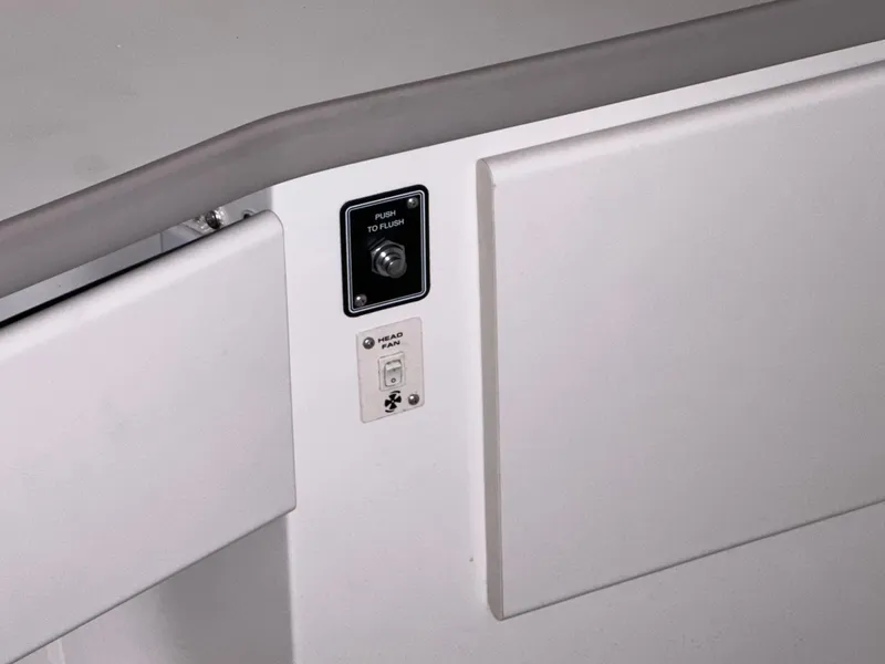 Slide: The Image of 1994 Carver 340 Santego boat interior with control panel and push button. - 22