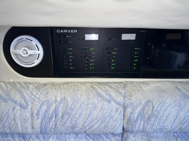 Slide: The Image of Control panel of a 1994 Carver 340 Santego boat with speaker and cushioned seating. - 24