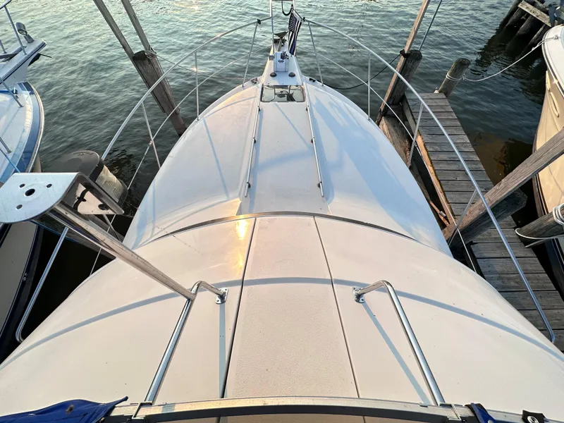 Slide: The Image of Top view of a 1994 Carver 340 Santego boat docked at a marina. - 5