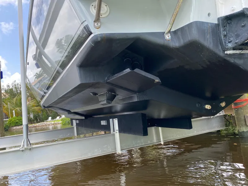 Slide: The Image of 2001 Intrepid 377 Walkaround boat hull on lift, showcasing sleek design and sturdy construction. - 10