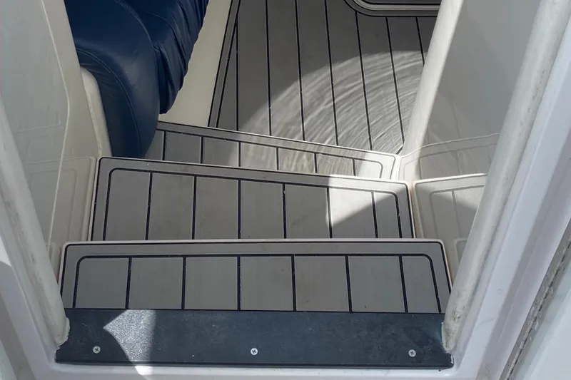 Slide: The Image of Interior steps of a 2001 Intrepid 377 Walkaround boat with sleek, modern design. - 30