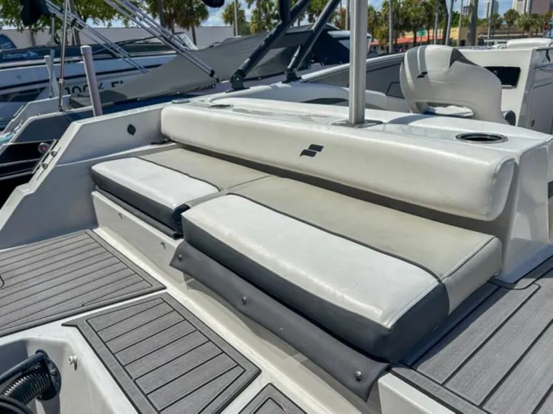 Slide: The Image of 2024 Starcraft SVX 231 OB DH boat interior with cushioned seating and modern design. - 11