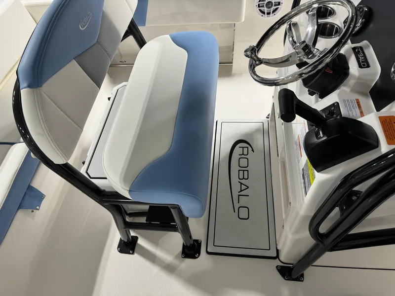 Slide: The Image of 2025 Robalo R202 Explorer boat interior with steering wheel and seating. - 10