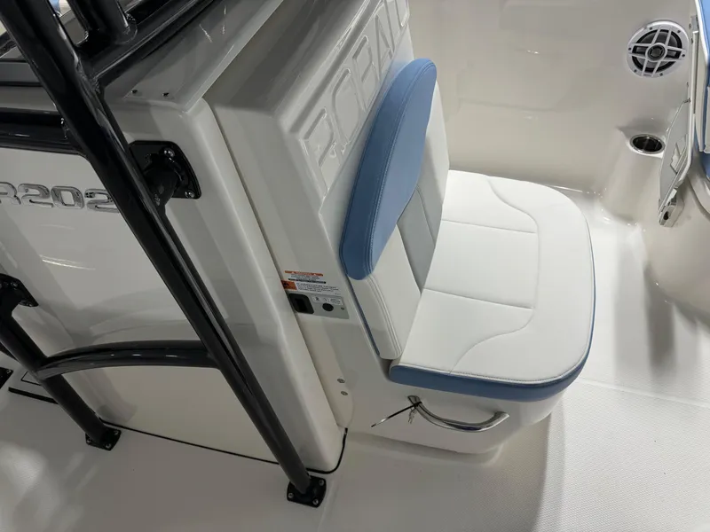 Slide: The Image of 2025 Robalo R202 Explorer boat seat with blue and white upholstery. - 13