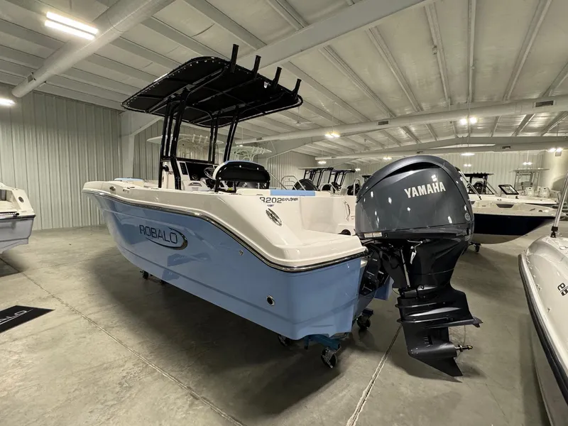 Slide: The Image of 2025 Robalo R202 Explorer boat with Yamaha engine in showroom. - 3