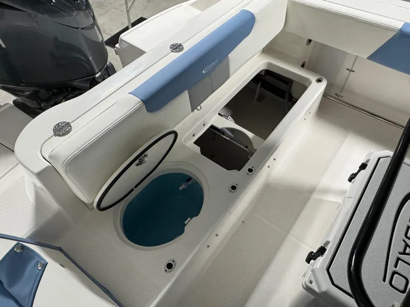 Slide: The Image of 2025 Robalo R202 Explorer boat interior with storage compartments and seating. - 7