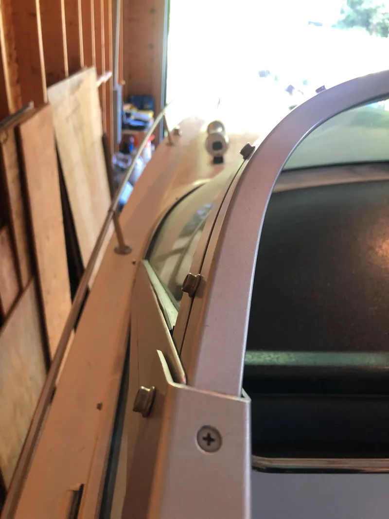 Slide: The Image of 1991 Sea Ray 250 Weekender boat detail in a garage setting. - 19