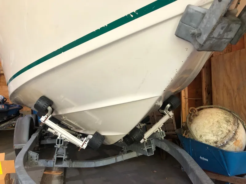 Slide: The Image of 1991 Sea Ray 250 Weekender boat on trailer in storage shed. - 2
