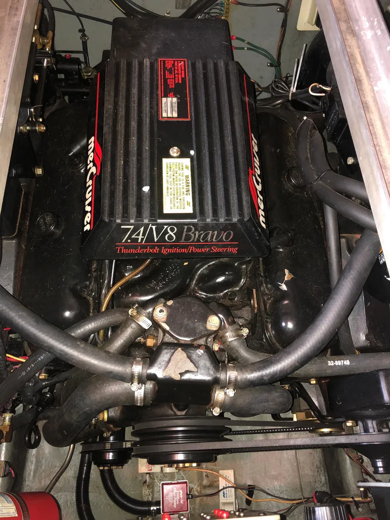 Slide: The Image of Engine of a 1991 Sea Ray 250 Weekender boat, featuring a MerCruiser 7.4L V8 Bravo. - 22