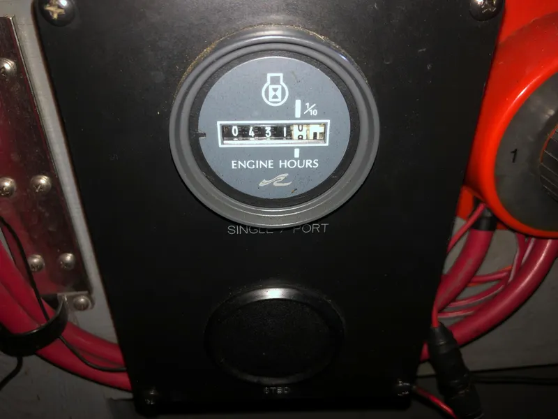 Slide: The Image of 1991 Sea Ray 250 Weekender engine hour meter showing 631.1 hours. - 23