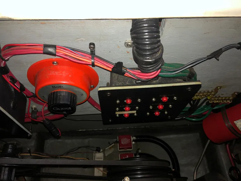 Slide: The Image of Electrical panel and wiring inside a 1991 Sea Ray 250 Weekender boat. - 24