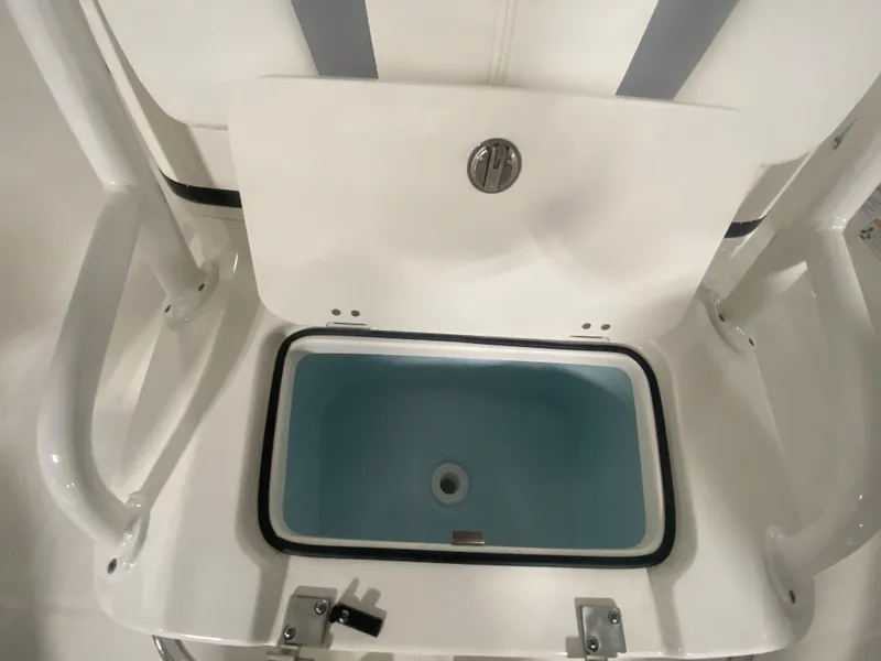 Slide: The Image of 2024 Robalo 206 Cayman livewell compartment with open lid. - 15