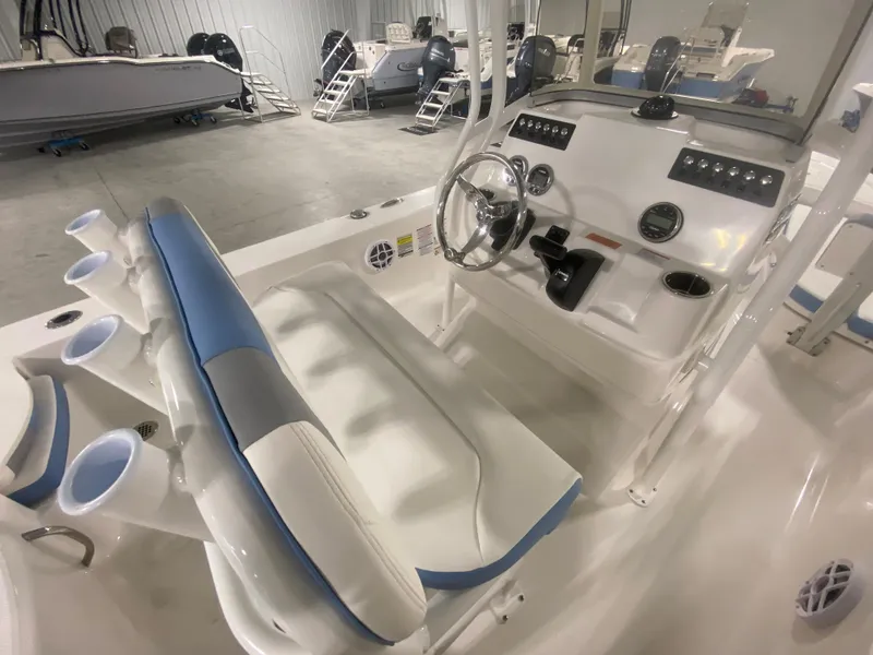 Slide: The Image of 2024 Robalo 206 Cayman boat interior with steering console and seating. - 16