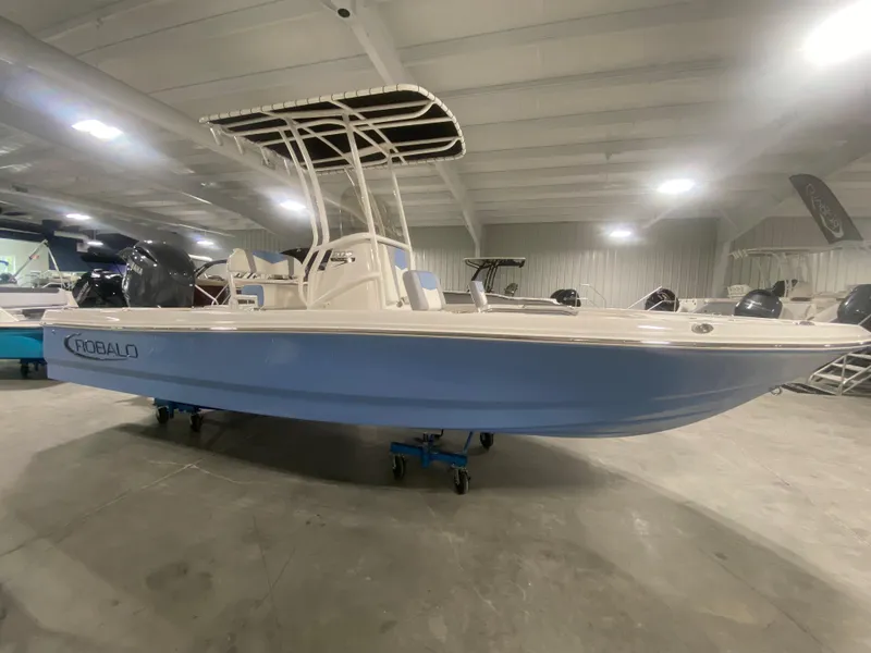 Slide: The Image of 2024 Robalo 206 Cayman boat in showroom. - 3