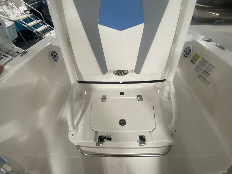 Slide: The Image of 2024 Robalo 206 Cayman boat interior with storage compartment and seating. - 14