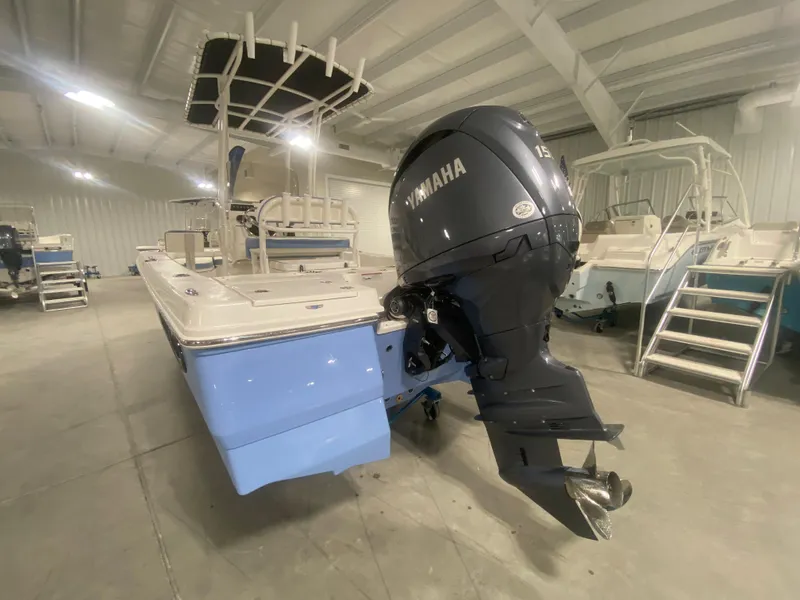 Slide: The Image of 2024 Robalo 206 Cayman boat with Yamaha outboard motor in showroom. - 5