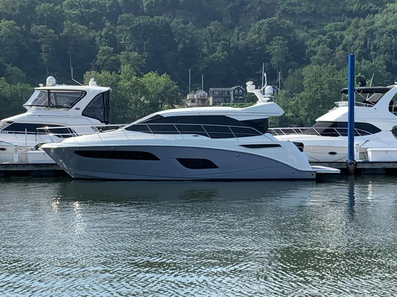 Slide: The Image of 2017 Sea Ray Sundancer 460 yacht docked in a marina. - 1