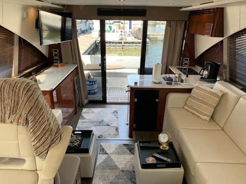 Slide: The Image of Luxurious interior of 2017 Sea Ray Sundancer 460 yacht with modern furnishings and marina view. - 20
