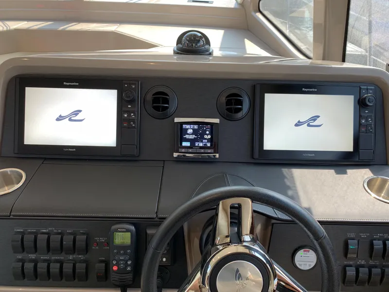 Slide: The Image of 2017 Sea Ray Sundancer 460 helm with dual Raymarine displays. - 27