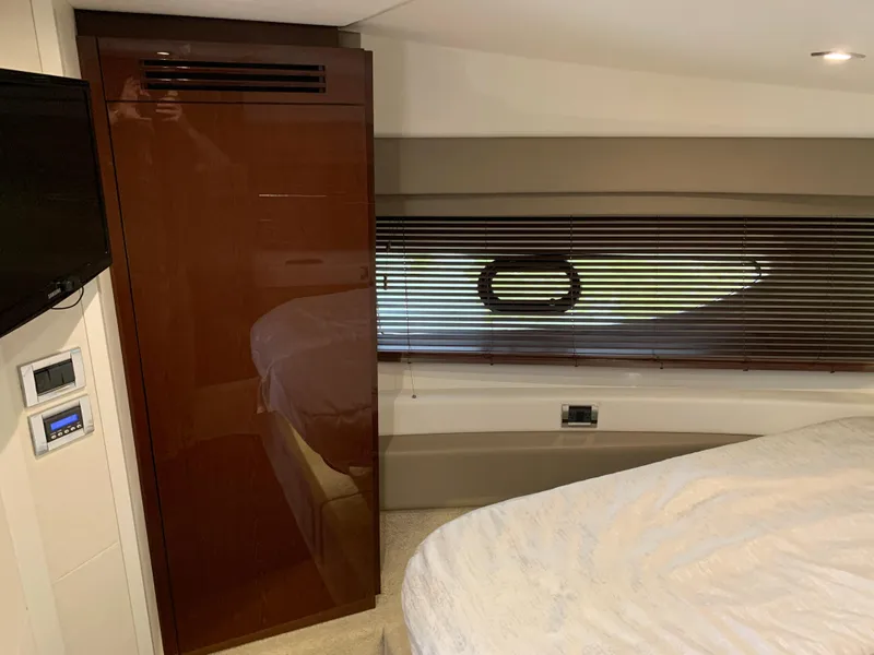 Slide: The Image of Interior cabin of 2017 Sea Ray Sundancer 460 yacht with bed and window blinds. - 37
