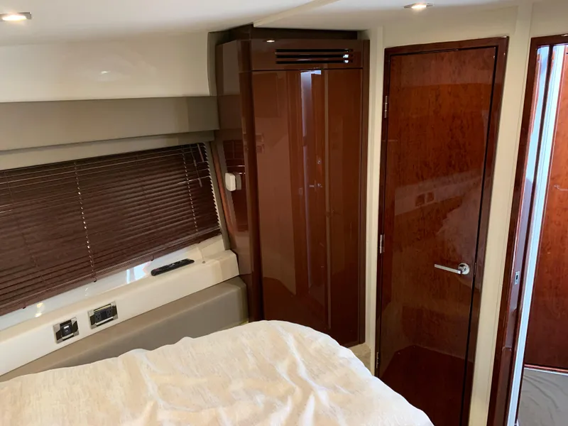 Slide: The Image of Interior cabin of 2017 Sea Ray Sundancer 460 yacht with wooden finishes. - 38