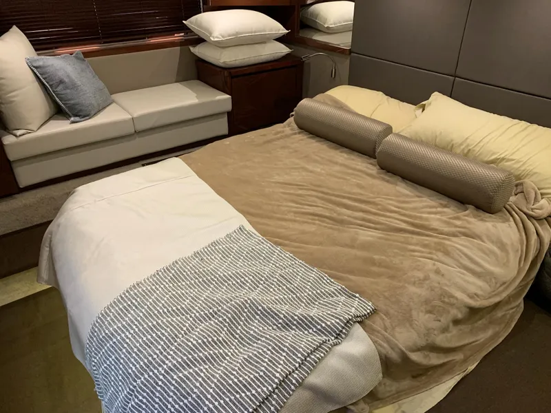 Slide: The Image of Luxurious bedroom interior of 2017 Sea Ray Sundancer 460 yacht with cozy bed and seating area. - 48