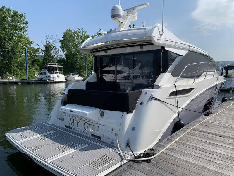 Slide: The Image of 2017 Sea Ray Sundancer 460 yacht docked at a marina. - 5