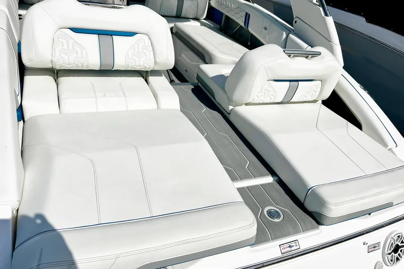 Slide: The Image of 2024 Regal LS9 boat interior with luxurious white seating and modern design. - 13