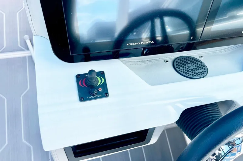 Slide: The Image of 2024 Regal LS9 boat dashboard with joystick thruster and Volvo Penta display. - 16