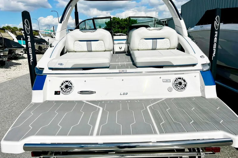 Slide: The Image of 2024 Regal LS9 boat with sleek design, spacious seating, and modern features. - 8