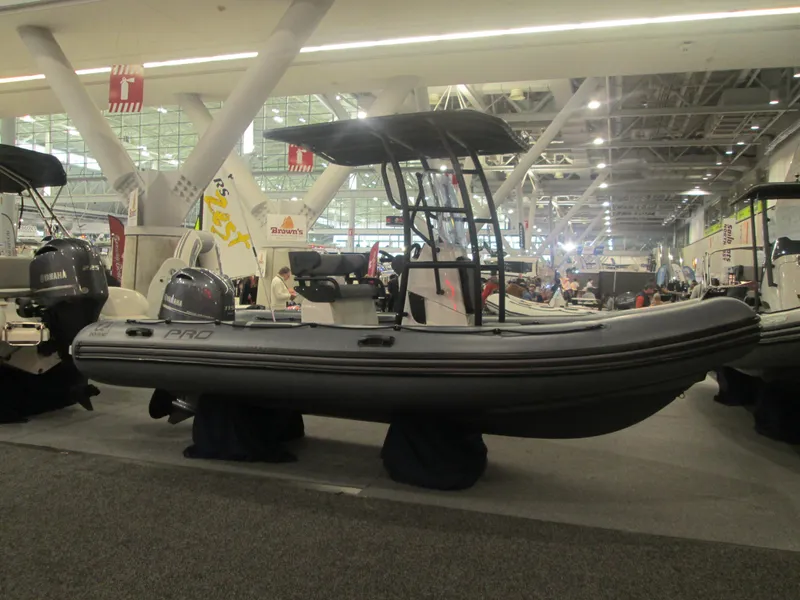 The Image of 2024 Zodiac Pro 5.5 inflatable boat displayed at an indoor boat show. - 0