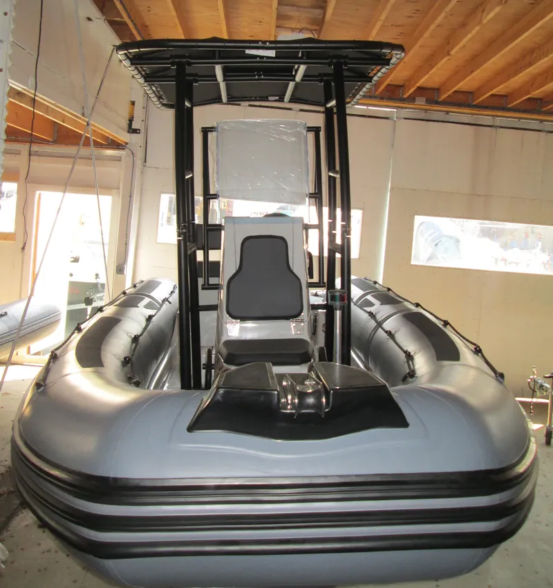 Slide: The Image of 2024 Zodiac Pro 5.5 inflatable boat in a garage, front view. - 3