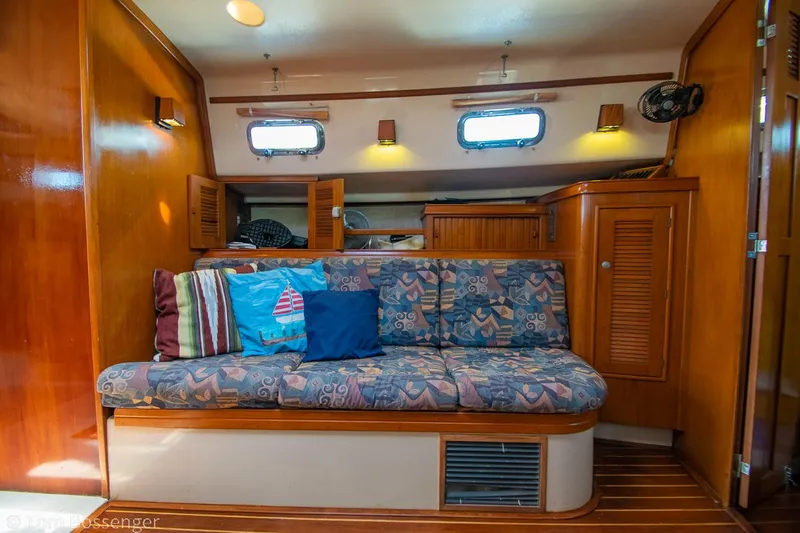 Slide: The Image of Interior of 1997 Island Packet 45 sailboat with cozy seating and nautical decor. - 20